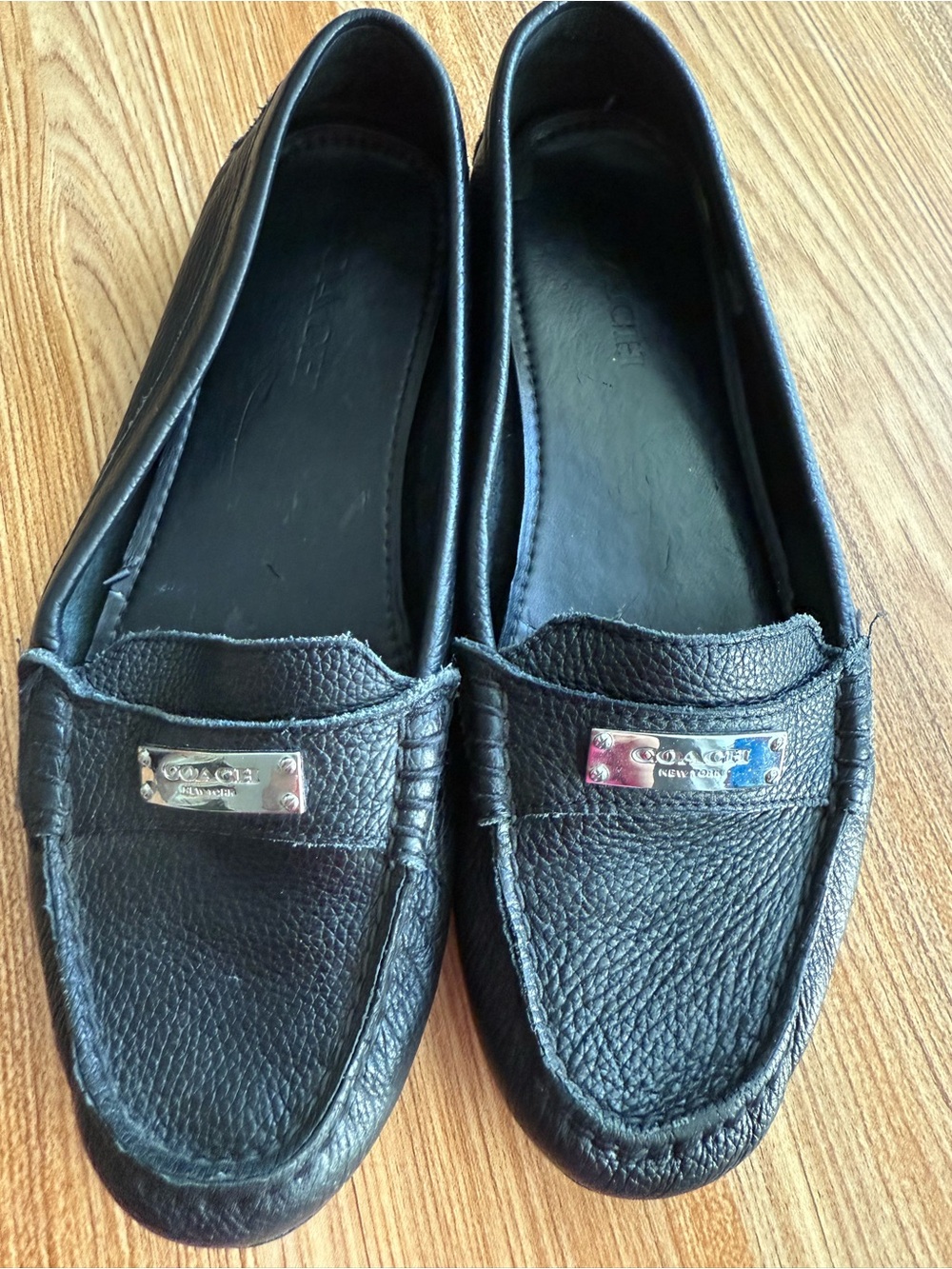 Coach Women’s Black Pebbled Leather Loafers with Silver Plaque, size 9